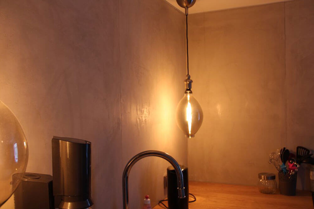 Foto zur Inspiration: Betonoptik an einer Küchenwand